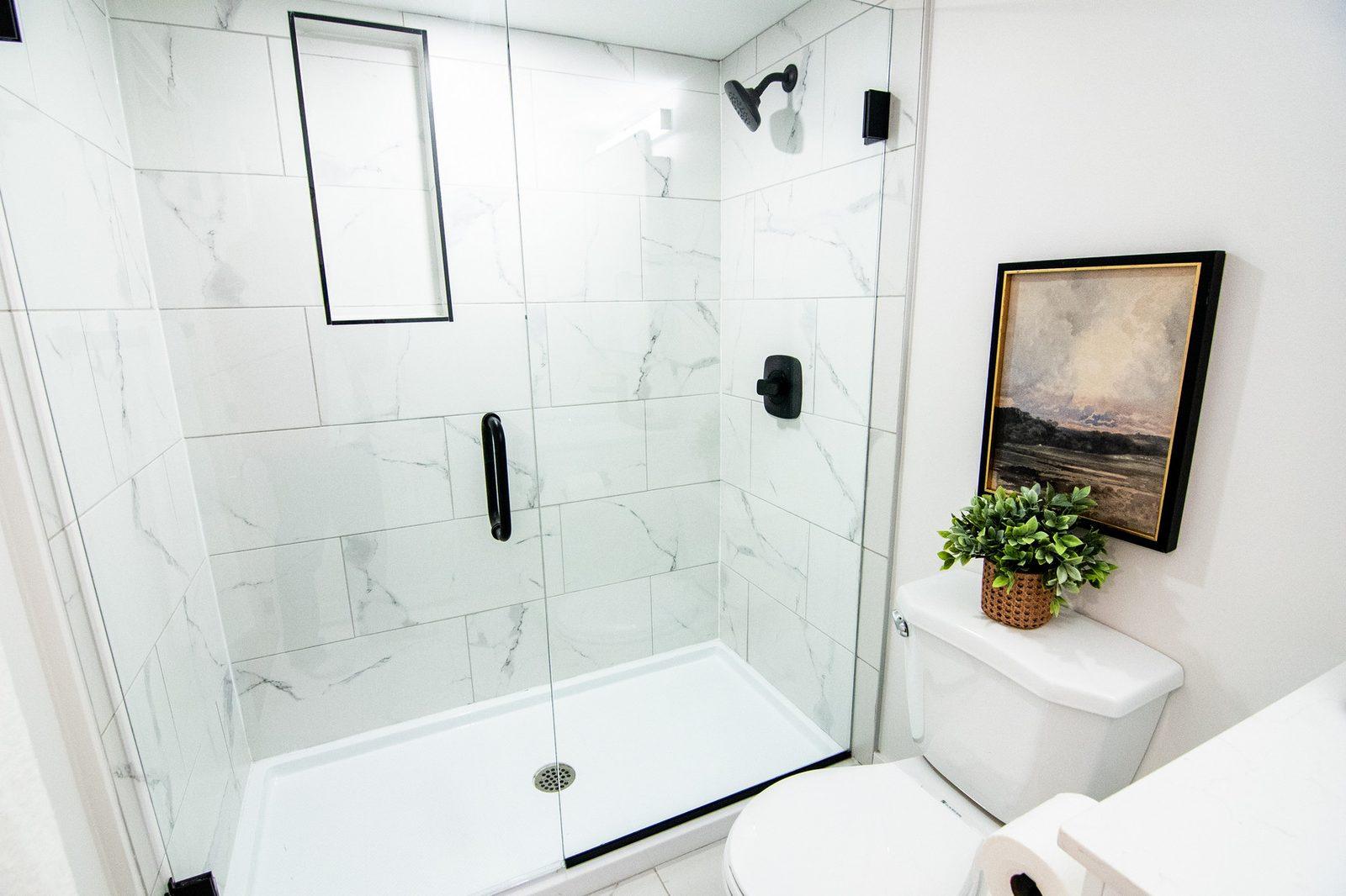 Tiled bathroom with glass shower